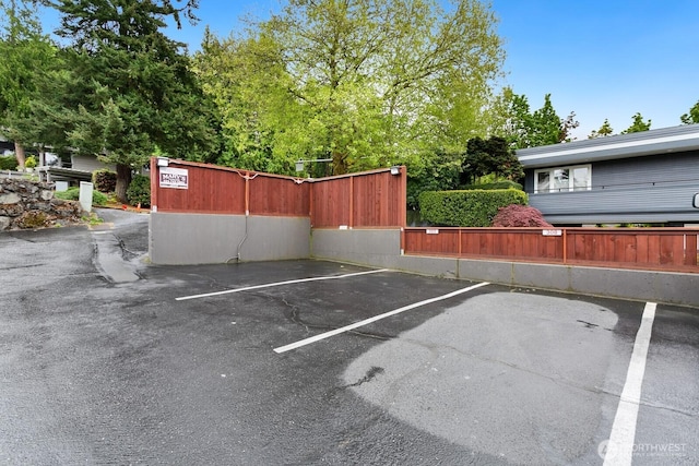 uncovered parking lot with fence