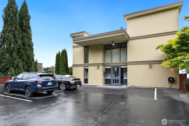 view of property with uncovered parking
