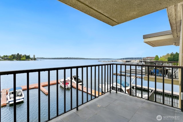 balcony featuring a water view