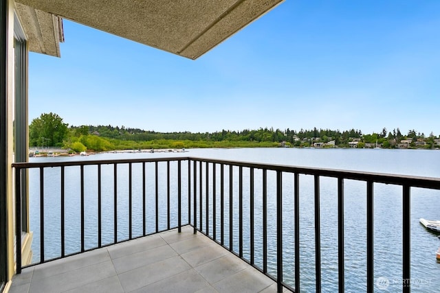 balcony featuring a water view