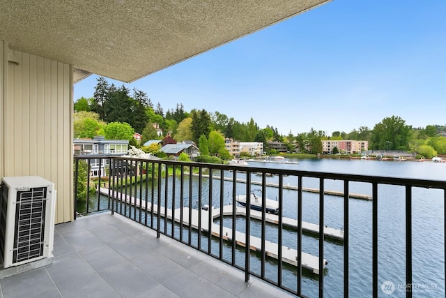 balcony featuring a water view