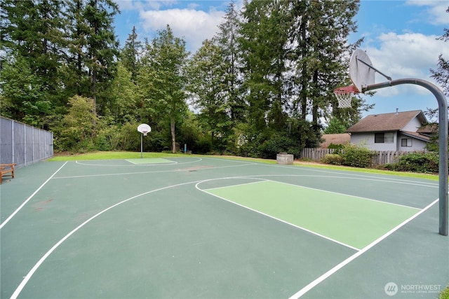 view of basketball court featuring community basketball court and fence