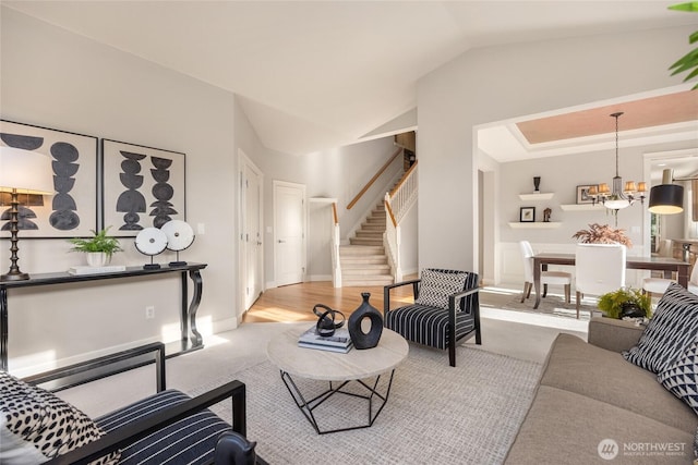 1893 Commodore Ln NW, Bainbridge Island, WA 98110 - living room featuring stairs, carpet, vaulted ceiling, and a chandelier