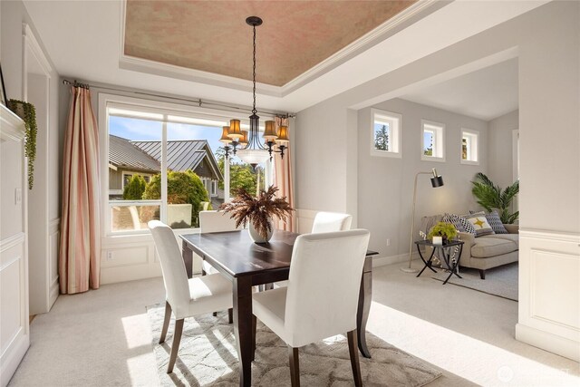 1893 Commodore Ln NW, Bainbridge Island, WA 98110 - dining area featuring light carpet, a tray ceiling, ornamental molding, a chandelier, and a decorative wall