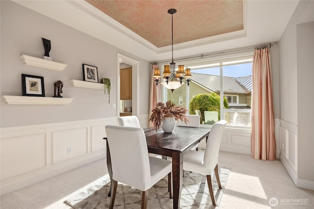 1893 Commodore Ln NW, Bainbridge Island, WA 98110 - dining area with a chandelier, a decorative wall, light carpet, a tray ceiling, and a wainscoted wall