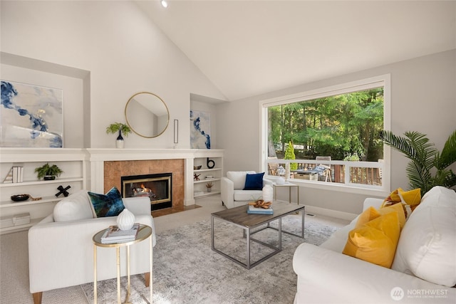 1893 Commodore Ln NW, Bainbridge Island, WA 98110 - carpeted living room with vaulted ceiling, a tiled fireplace, and baseboards