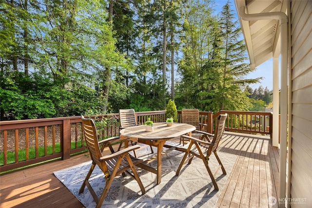 1893 Commodore Ln NW, Bainbridge Island, WA 98110 - deck with outdoor dining space and view of scattered trees