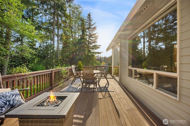 1893 Commodore Ln NW, Bainbridge Island, WA 98110 - wooden terrace featuring a fire pit and outdoor dining area