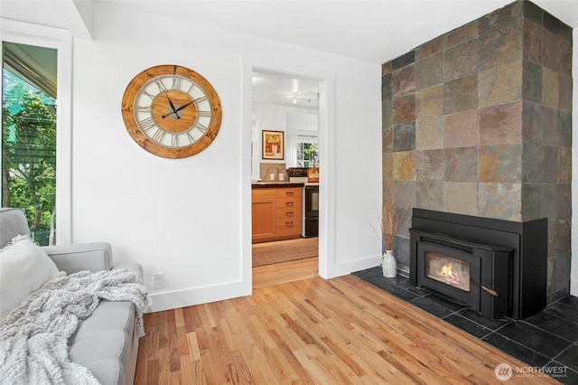 10515 NE 189th St, Bothell, WA 98011 - living area with plenty of natural light, light wood-style floors, and baseboards