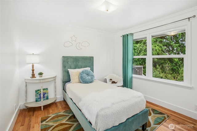 10515 NE 189th St, Bothell, WA 98011 - bedroom with ornamental molding, wood finished floors, and baseboards