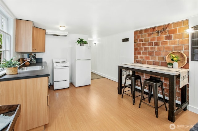 10515 NE 189th St, Bothell, WA 98011 - kitchen featuring white appliances, a sink, dark countertops, light wood-type flooring, and light brown cabinets