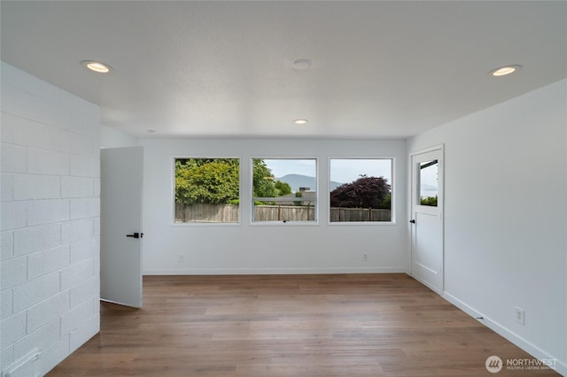 5310 Sunset Ave, Anacortes, WA 98221 - spare room featuring wood finished floors and recessed lighting