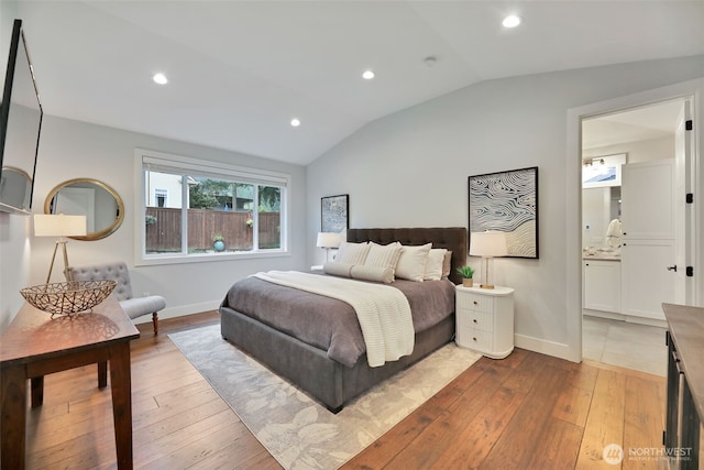 bedroom with recessed lighting, vaulted ceiling, baseboards, and hardwood / wood-style flooring