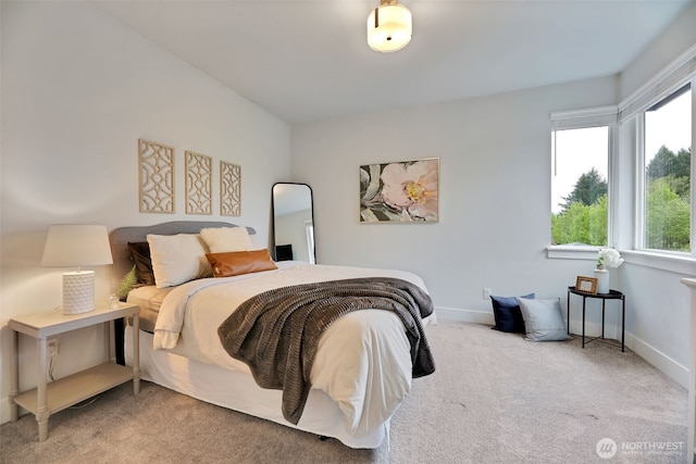 bedroom featuring carpet floors and baseboards