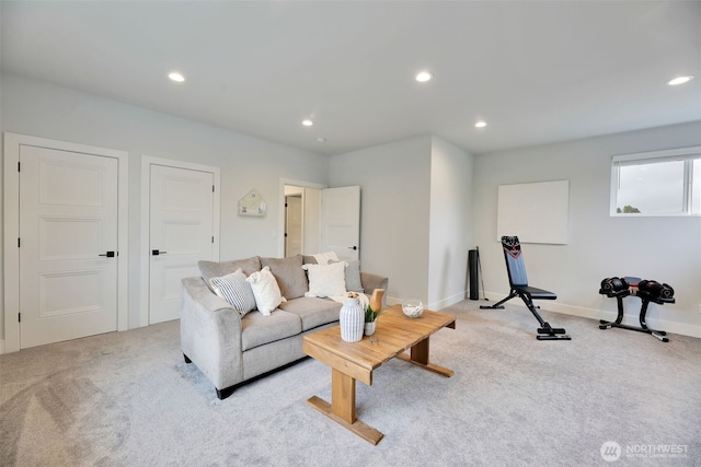 living room with baseboards, light carpet, and recessed lighting