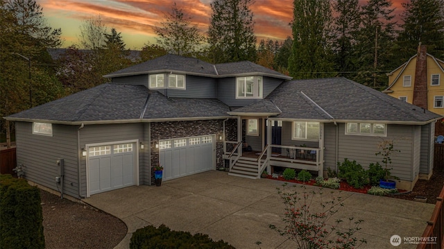 traditional-style home with concrete driveway and an attached garage