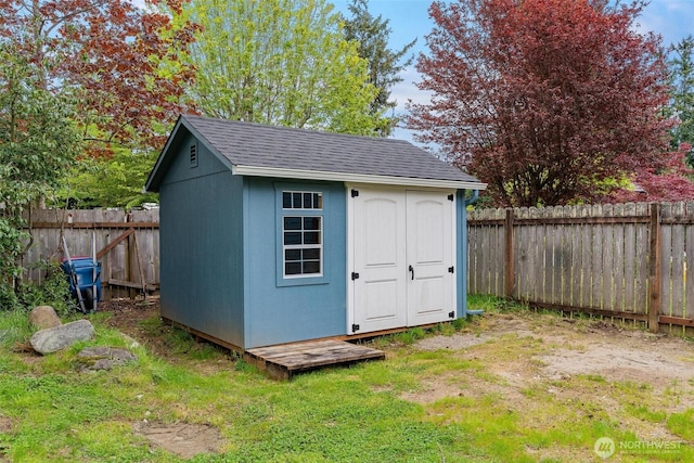view of shed featuring a fenced backyard