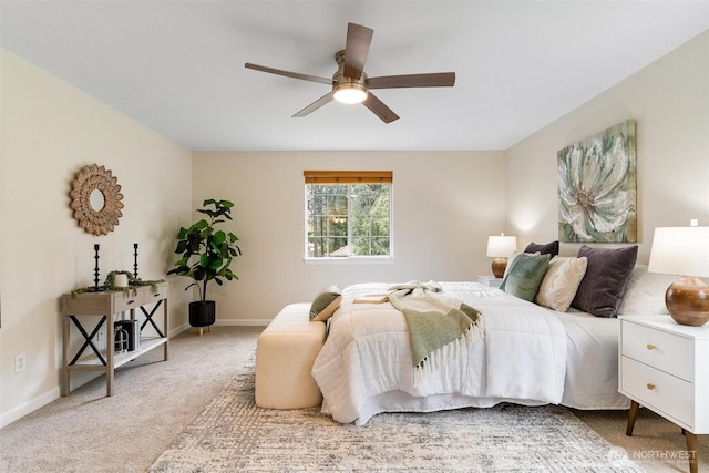 bedroom featuring a ceiling fan, baseboards, and carpet
