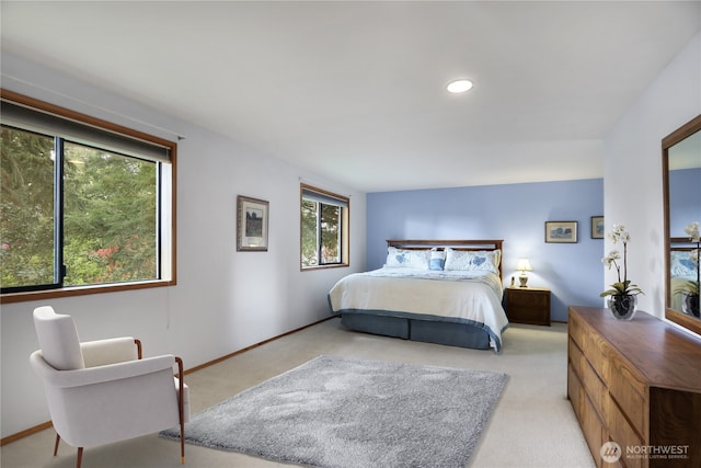 bedroom featuring baseboards, recessed lighting, and light colored carpet