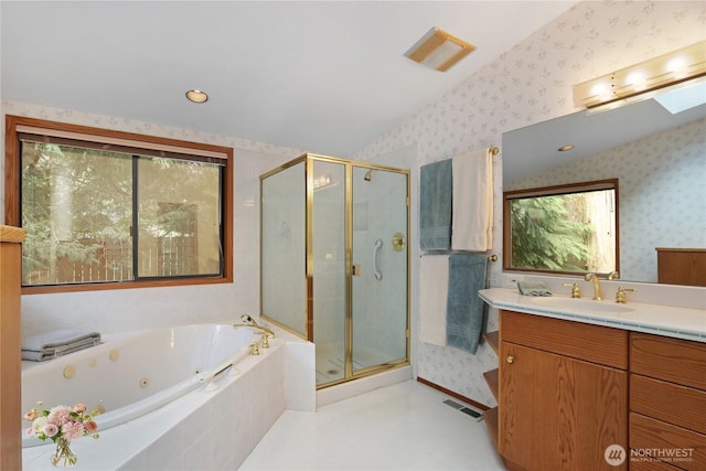 full bathroom featuring vanity, a whirlpool tub, wallpapered walls, visible vents, and a stall shower