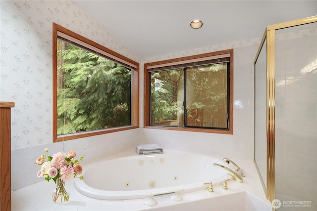 full bathroom featuring a whirlpool tub, a shower stall, and wallpapered walls