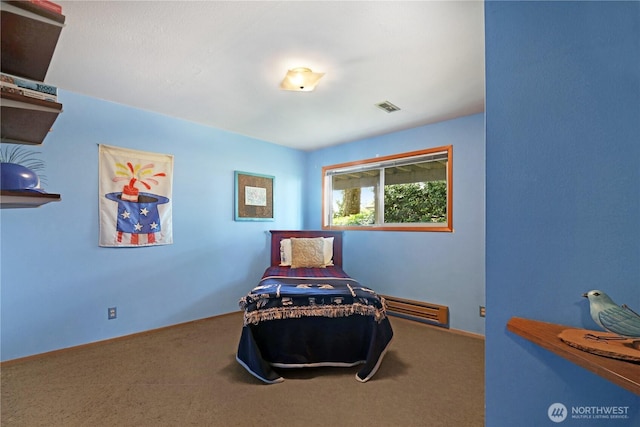 living area featuring visible vents, a baseboard radiator, and carpet flooring