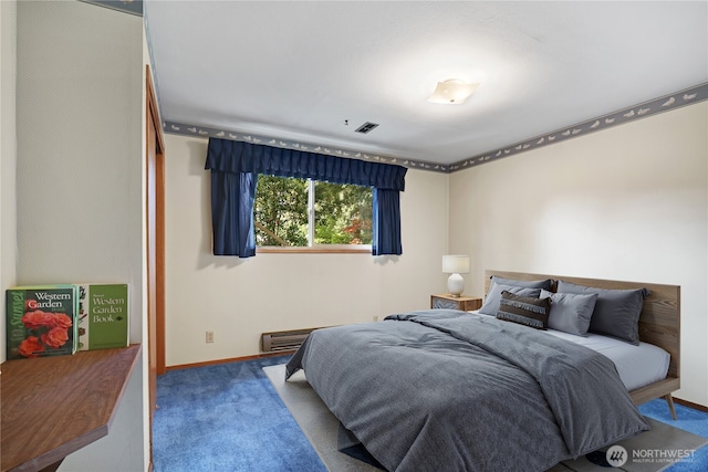 bedroom featuring visible vents, baseboards, and carpet floors