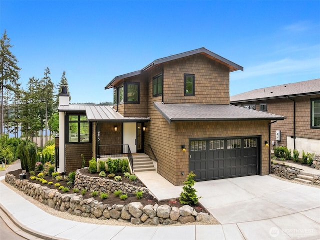 4815 Rosalind Rd NE, Bainbridge Island, WA 98110 - view of front of property featuring concrete driveway, a standing seam roof, covered porch, metal roof, and a chimney