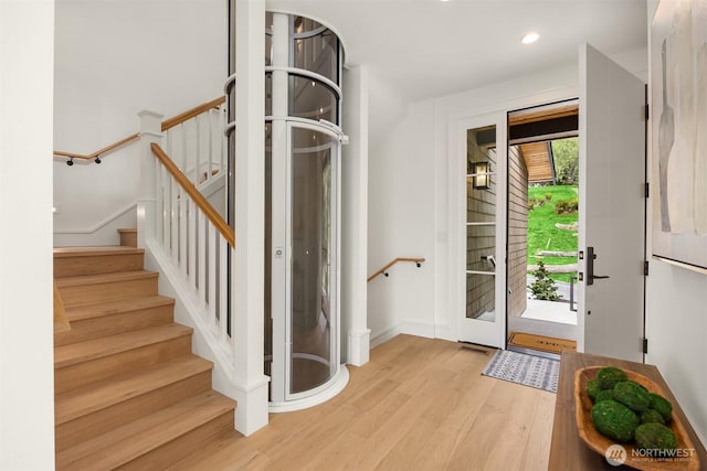 4815 Rosalind Rd NE, Bainbridge Island, WA 98110 - foyer entrance featuring wood finished floors, recessed lighting, stairway, and baseboards