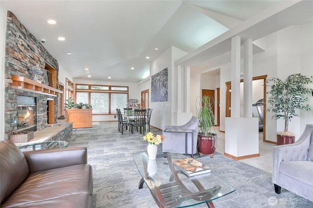 living area featuring recessed lighting and a fireplace
