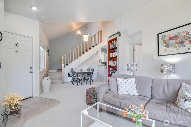 carpeted living room with stairway