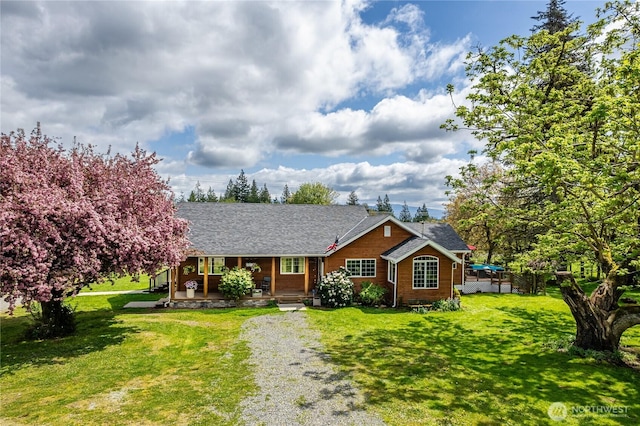 28405 59th Ave NE, Arlington, WA 98223 - ranch-style house with a front yard and a porch