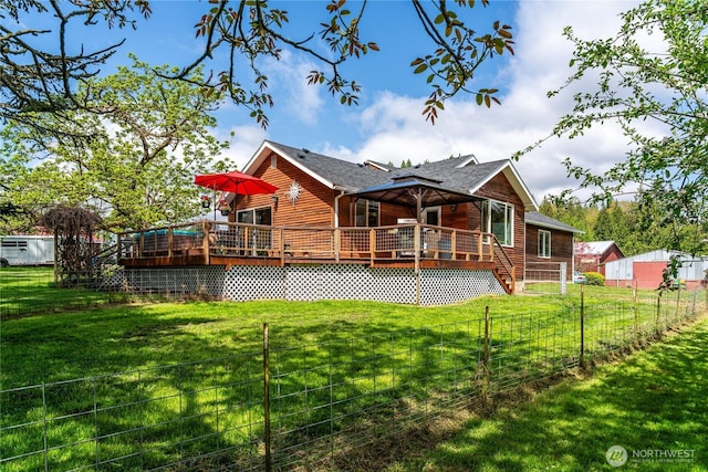 28405 59th Ave NE, Arlington, WA 98223 - back of property featuring a lawn, a wooden deck, roof with shingles, and fence