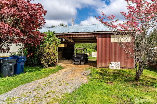 28405 59th Ave NE, Arlington, WA 98223 - view of pole building with driveway, a lawn, and an attached carport