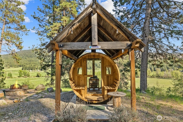 view of patio with a fire pit