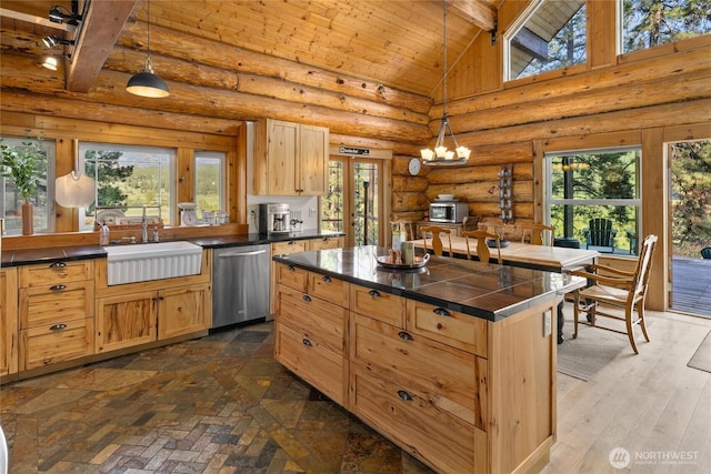 kitchen with dishwasher, a sink, beam ceiling, plenty of natural light, and high vaulted ceiling