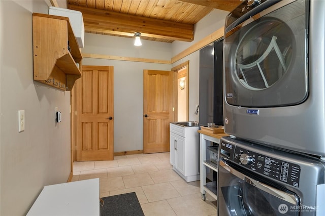 washroom with stacked washer and clothes dryer, cabinet space, wooden ceiling, and light tile patterned floors