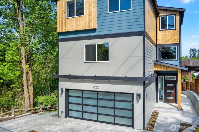 5732 Halls Lake Way, Lynnwood, WA 98036 - view of home's exterior with an attached garage, fence, and driveway