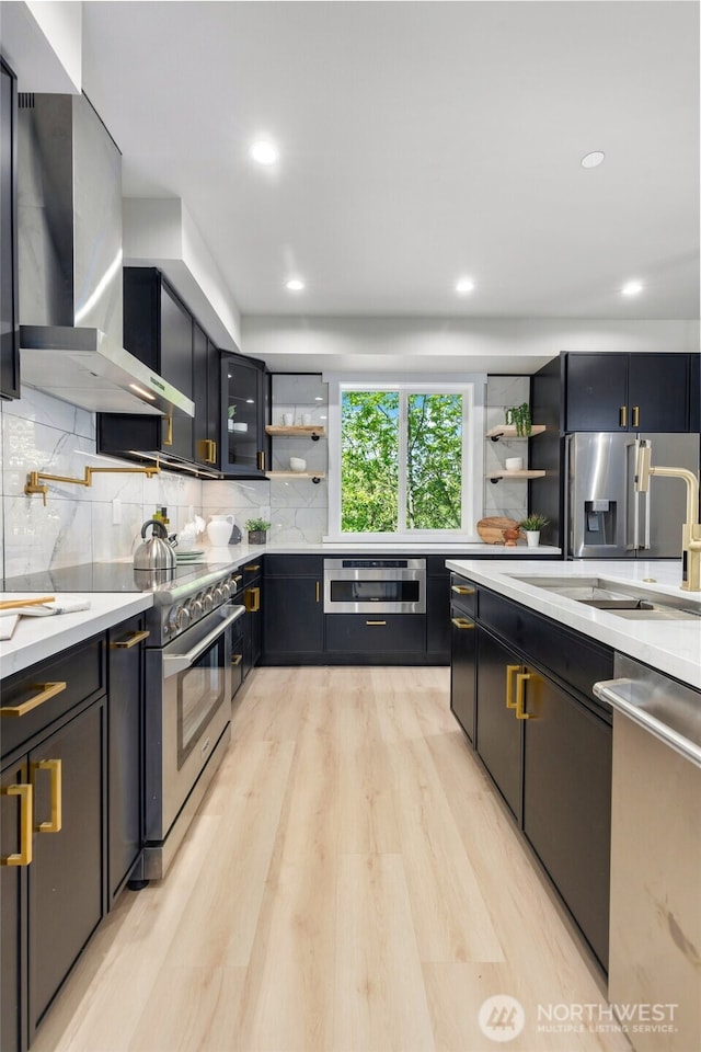 5732 Halls Lake Way, Lynnwood, WA 98036 - kitchen with wall chimney range hood, appliances with stainless steel finishes, open shelves, and a sink