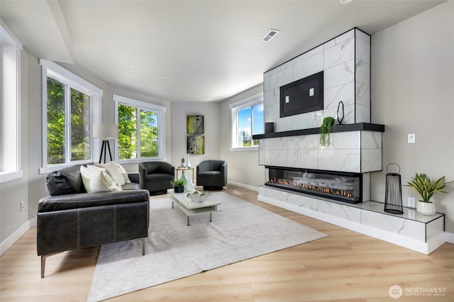 5732 Halls Lake Way, Lynnwood, WA 98036 - living room with baseboards, visible vents, wood finished floors, and a fireplace