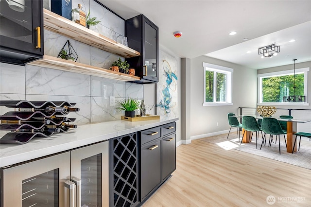 5732 Halls Lake Way, Lynnwood, WA 98036 - bar with decorative backsplash, light wood-style floors, baseboards, recessed lighting, and a dry bar