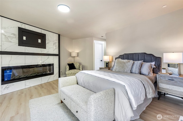 5732 Halls Lake Way, Lynnwood, WA 98036 - bedroom featuring wood finished floors and a fireplace