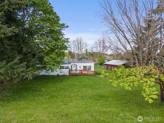 view of yard with a deck