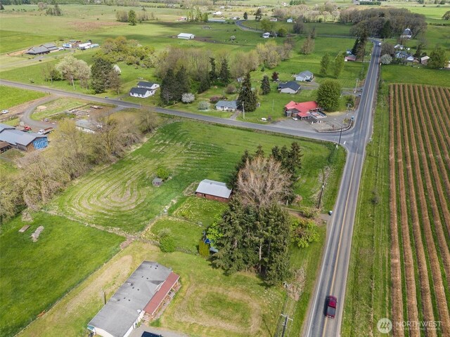 birds eye view of property featuring a rural view