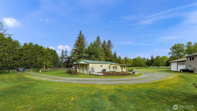 exterior space with a garage, fence, and driveway