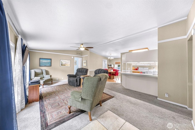 living area with ceiling fan, light carpet, a textured ceiling, baseboards, and lofted ceiling