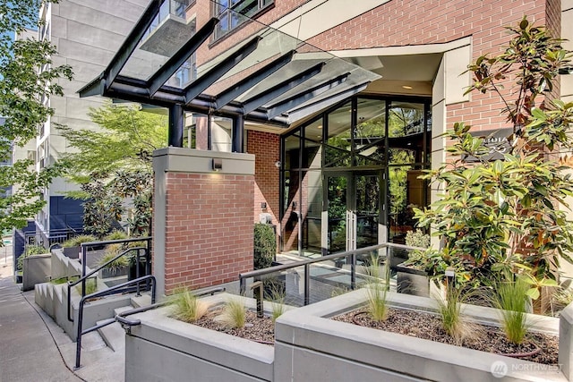 1420 Terry Ave Unit 603, Seattle, WA 98101 - property entrance featuring brick siding and french doors