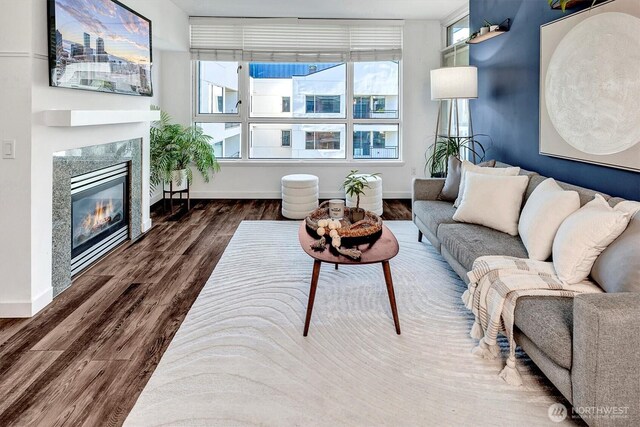 1420 Terry Ave Unit 603, Seattle, WA 98101 - living area with baseboards, wood finished floors, and a premium fireplace