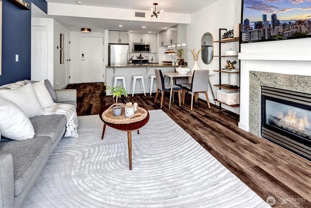 1420 Terry Ave Unit 603, Seattle, WA 98101 - living area with dark wood finished floors and a premium fireplace