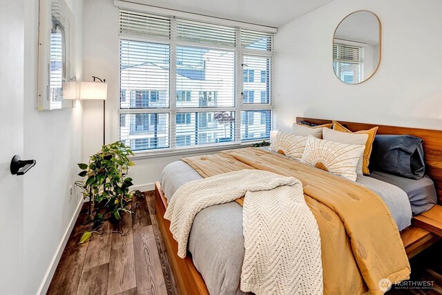 1420 Terry Ave Unit 603, Seattle, WA 98101 - bedroom featuring baseboards and wood finished floors